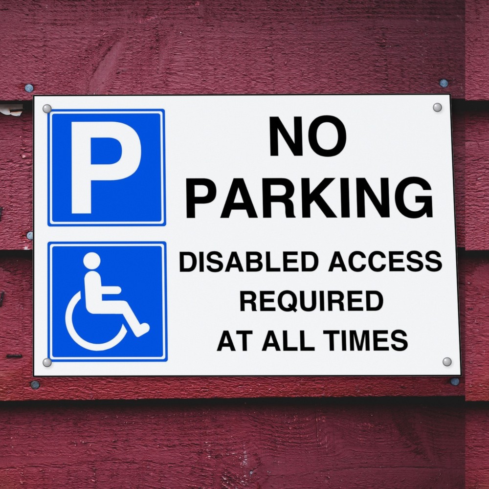No Parking Disabled Access Required at All Times sign in use