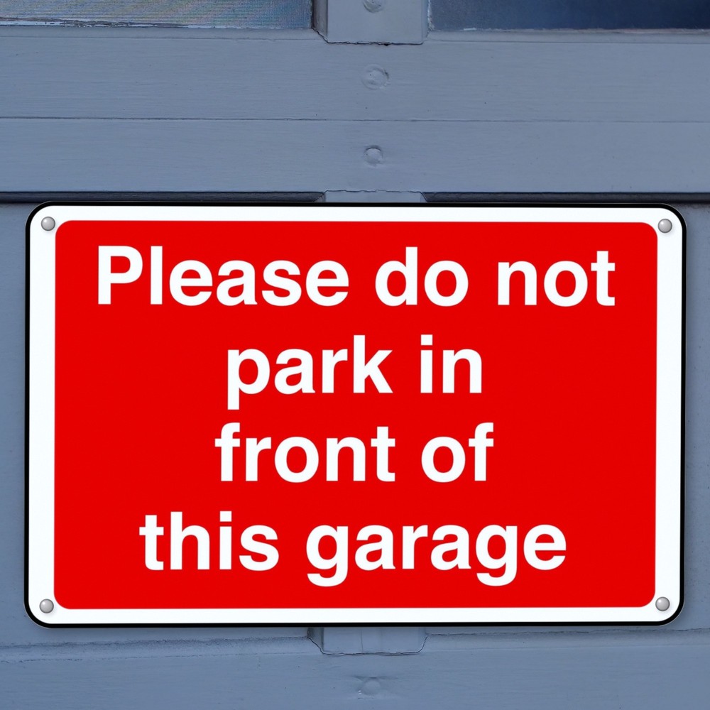 Please Do Not Park in Front of This Garage sign in use