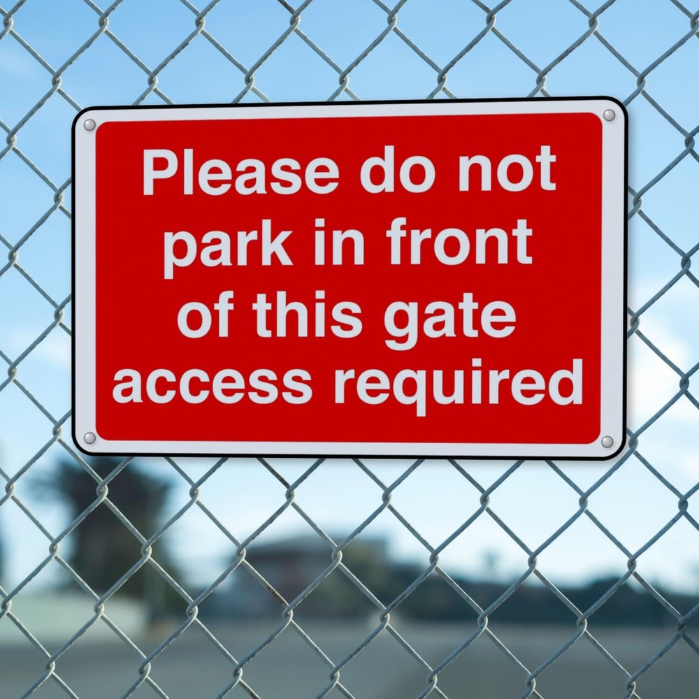 Please Do Not Park in Front of This Gate Access Required sign in use