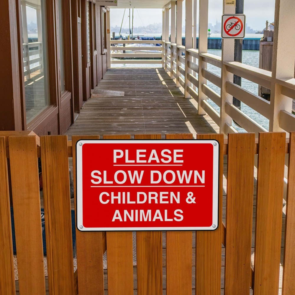 Please Slow Down Children Animals sign in use