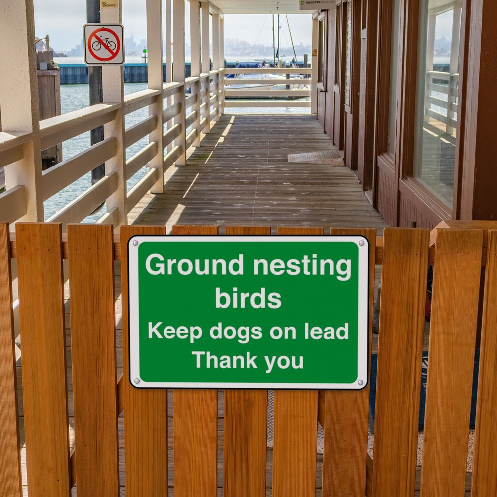 Ground Nesting Birds Keep Dogs on Lead Thank You sign in use